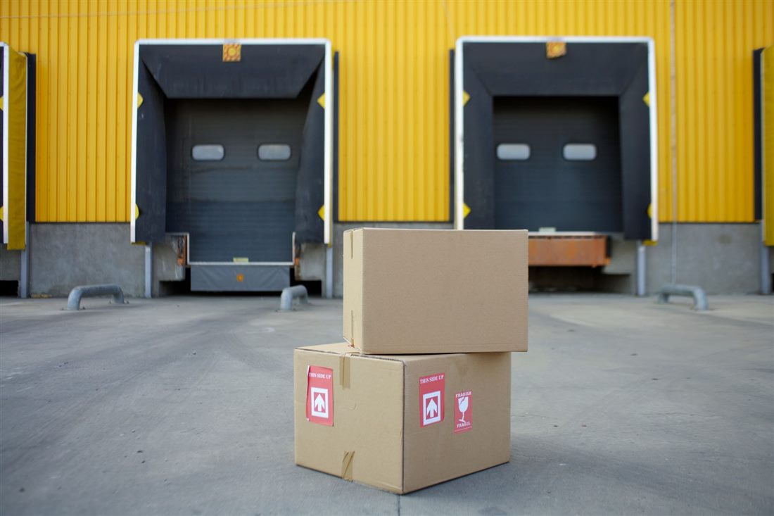 Warehouse building with two enclosed dock tunnel openings