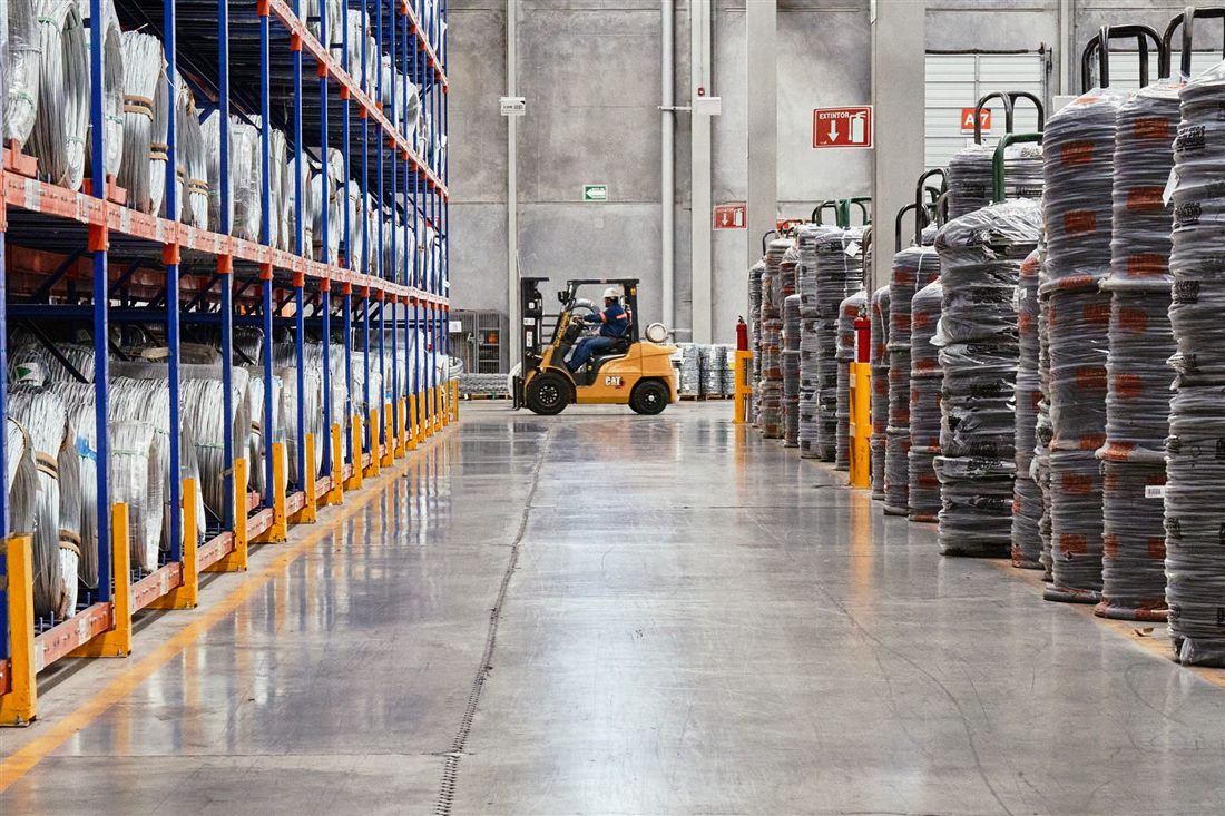 Forklift unloading goods at an industrial loading dock