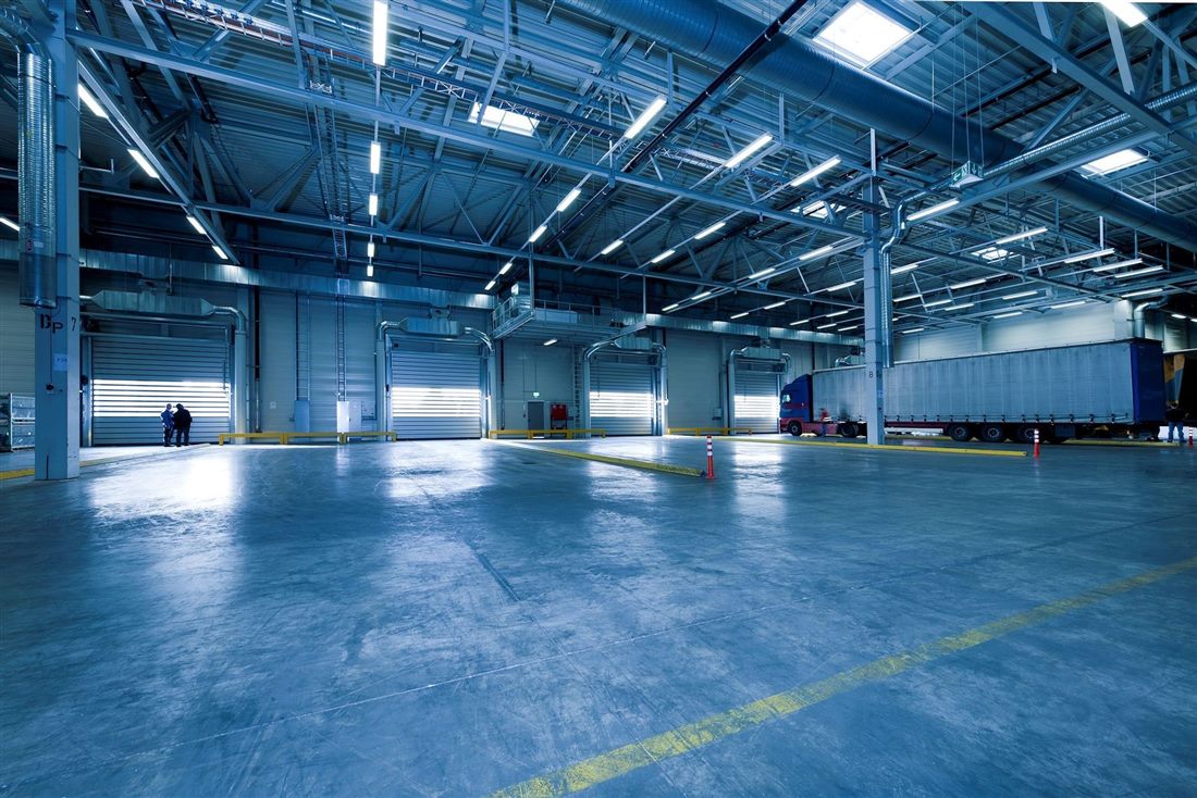 Truck docked at a warehouse loading bay interior