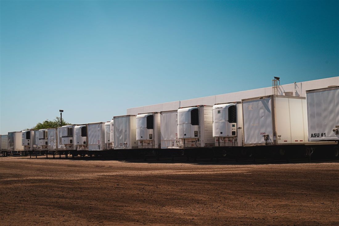 Refrigerated trucks parked in a cold chain logistics yard