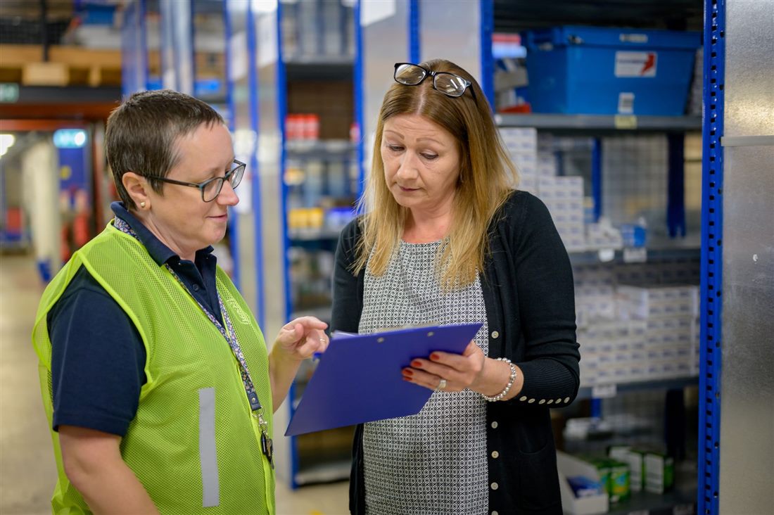 Warehouse team reviewing loading bay equipment specification