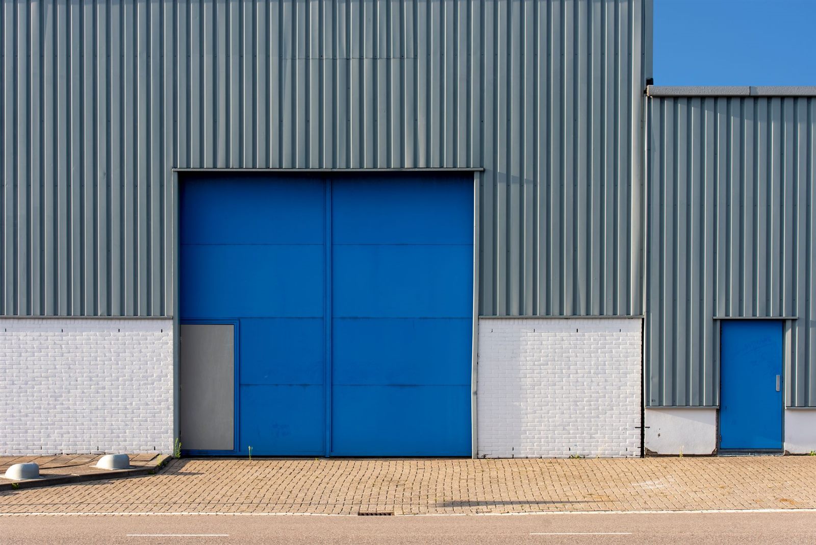 Industrial warehouse exterior with large doors