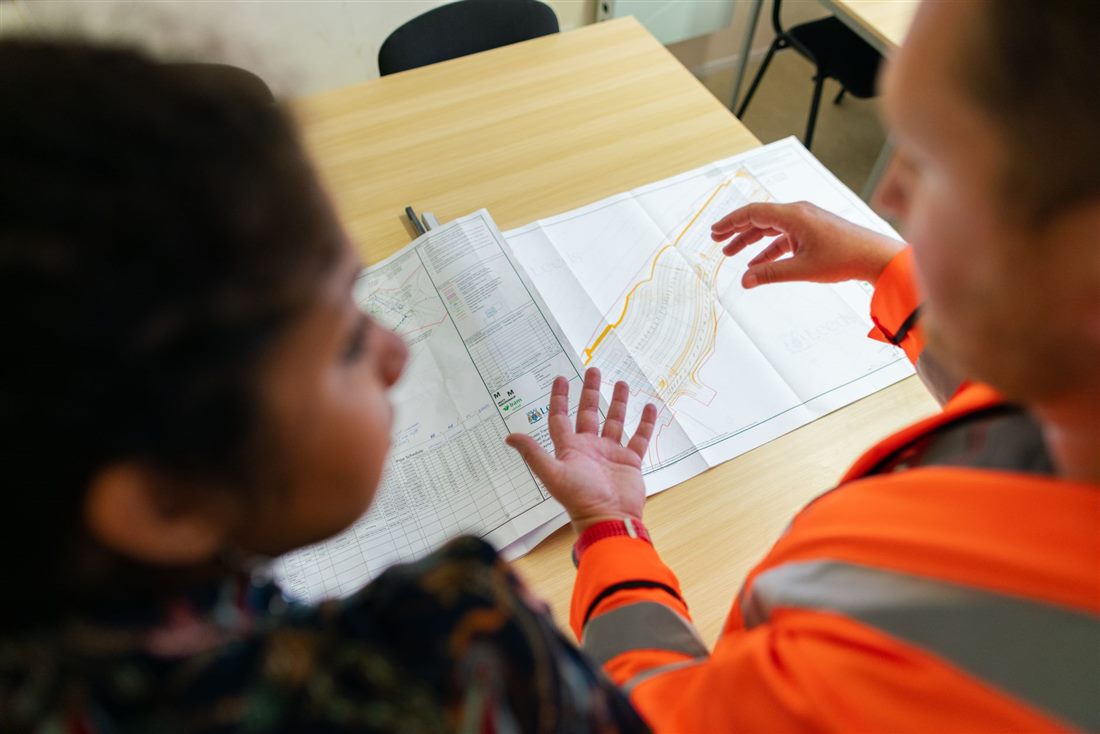 Engineers reviewing technical drawings for a loading bay project